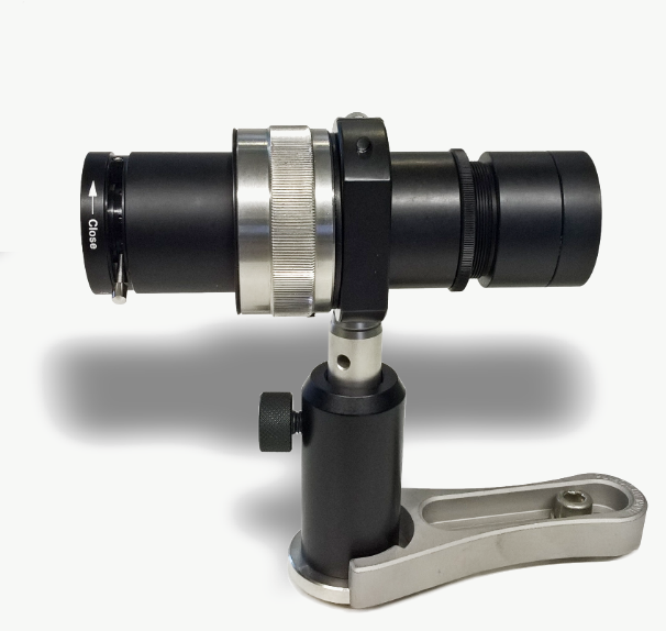 SHG-Unit, FS version: black cylindrical module with silver adjustment ring on a post holder with clamping fork.