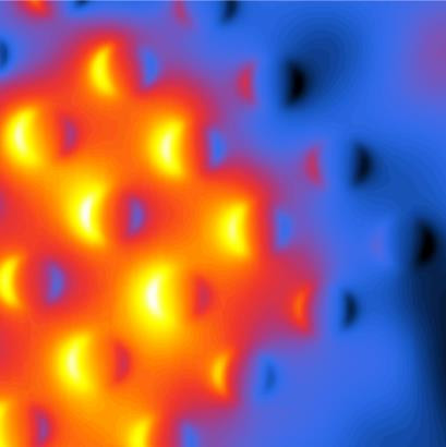 False-colour near-field map of the transversal THz field component Ex above a pulse-excited metamaterial surface, showing a periodic pattern of field maxima on the resonator array.